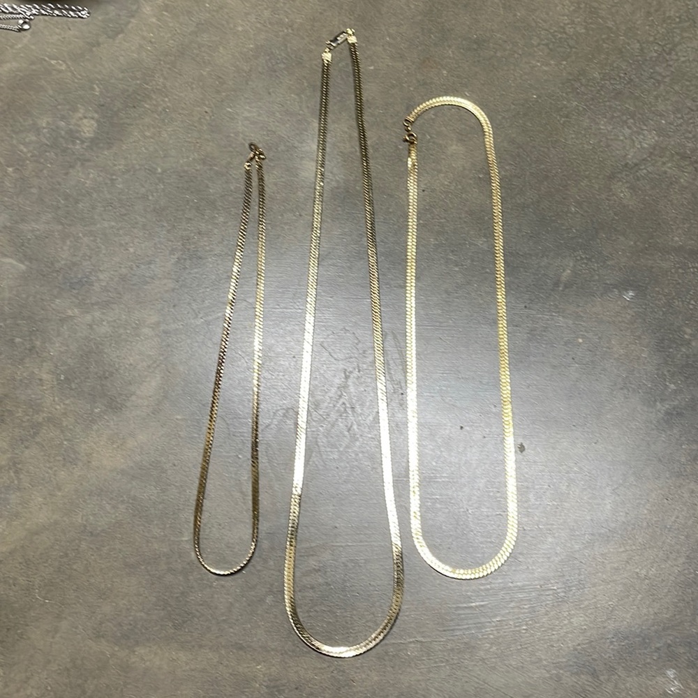 Gold necklaces.